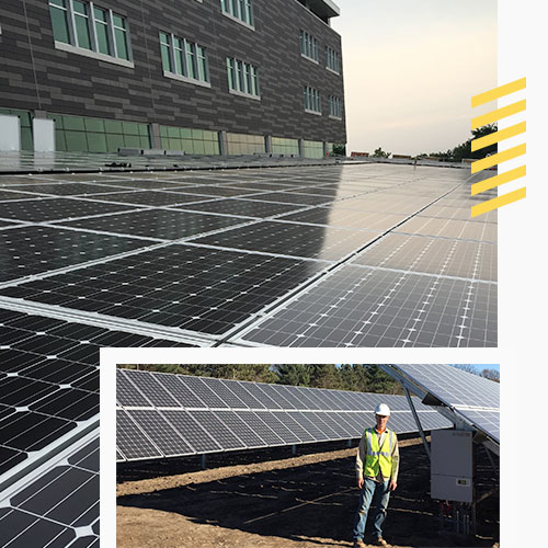 Worker standing by solar panels