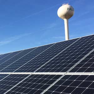 Solar panels next to water tower